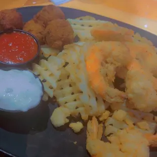 I had the Fried Jumbo Shrimp with Waffle Fries and Hush Puppies and it was delicious!