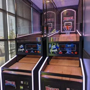 Basketball hoops located in their small arcade area