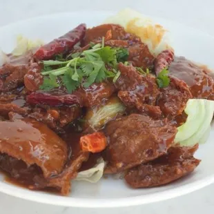 a plate of meat and vegetables