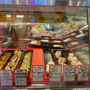 a display of meats and pastries
