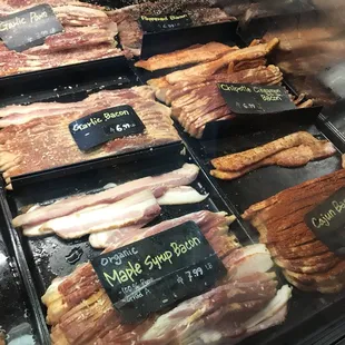 a variety of meats in a display case