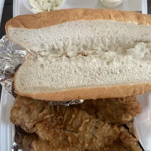 a chicken sandwich and coleslaw