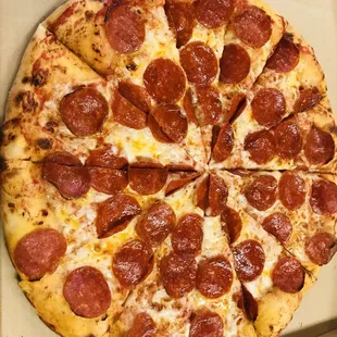 a pepperoni pizza in a box