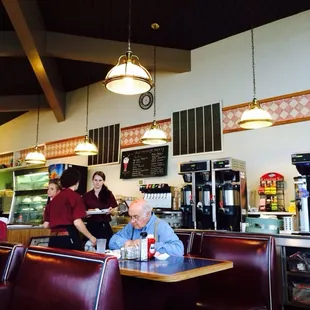 a waiter serving customers