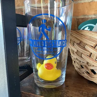 a rubber duck in a glass