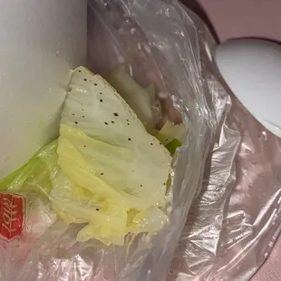 a roll of lettuce wrapped in plastic