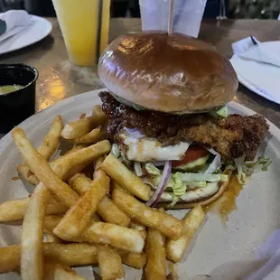 Chicken sandwich with fries and a mango margarita
