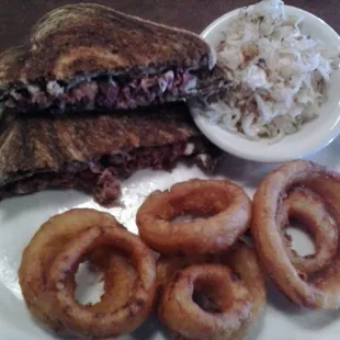 Ruben Sandwich w grilled kraut and beer battered onion rings