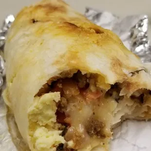 Chorizo breakfast burrito with pepperjack cheese, slicked red potatoes, a whole eggs scrambled, and salsa fresca)