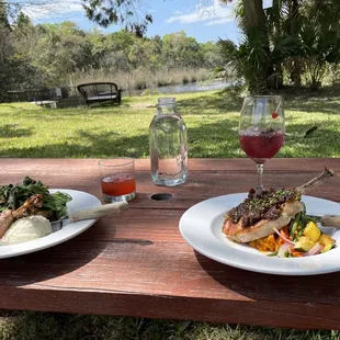 two plates of food on a picnic table
