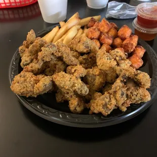 Gizzards, fries and sweet potato tots. Their gizzards were surprisingly tender!