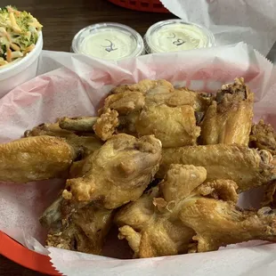 Neked wings with a side of broccoli salad.