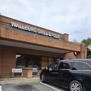 a car parked in front of the restaurant