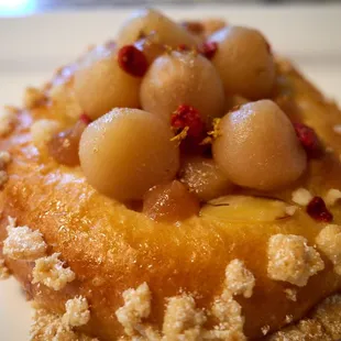 Pear and osmanthus brioche tart w/ goji berries, almonds, yuzu
