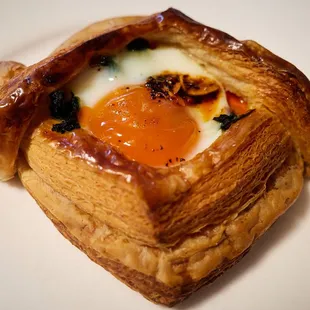 Breakfast Danish - onion soubise, kale, bacon, and topped with a soft-cooked egg