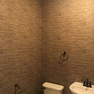 Vinyl grasscloth that you need to reach out and touch to see if it's real. Beautiful look!