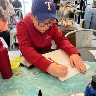Drawing his design for glass fusion