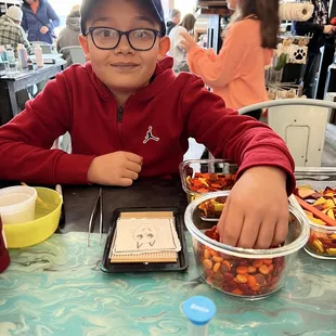 Choosing glass pieces for his art