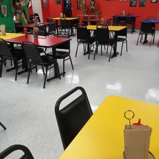 a dining room with tables and chairs