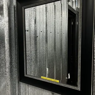 Bath room mirror. One handicap stall and one other stall besides