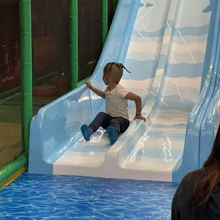 Him going down one of the slides(laughing face hidden for his protection)!