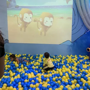 Throwing balls to hit the targets on the game. Grown ups loved this too.