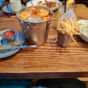 Shrimp cocktail with yummy spicy sauce shoestring fries and scrumptious coleslaw