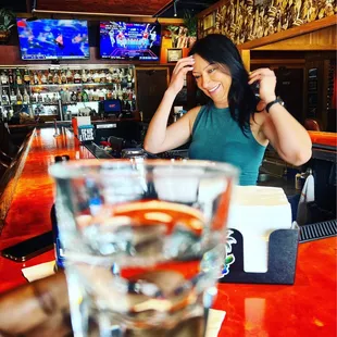 a woman sitting at a bar