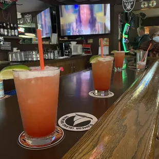 a row of drinks on a bar