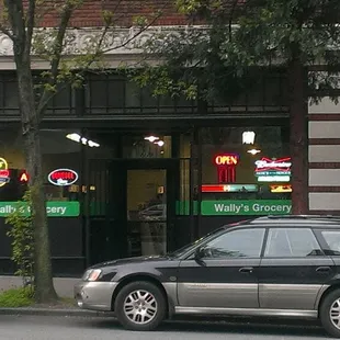 cars parked in front of a restaurant