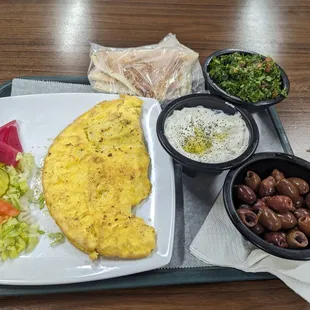 Omelette w Gyro meat, Tabouleh, Labneh and olives.