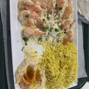 Garlic butter shrimp plate with rice and hummus