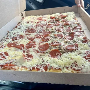 Full tray with pepperoni and half also with mushroom