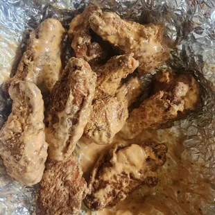 Mild Buffalo wings in a nasty sauce