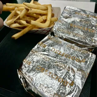 Fries and sandwiches, neatly wrapped