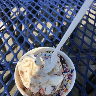 Medium cup with chocolate fudge and sprinkles