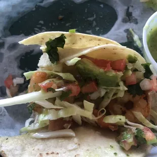 Shrimp taco partially eaten