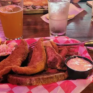 a plate of meat and fries