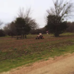 a man riding a lawn mower