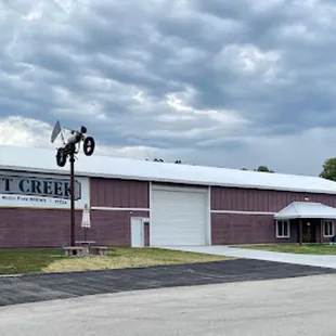 the front of the building and parking lot