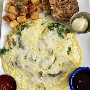 Scrambled eggs, potatoes and toast