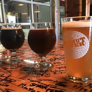 three beers on a bar