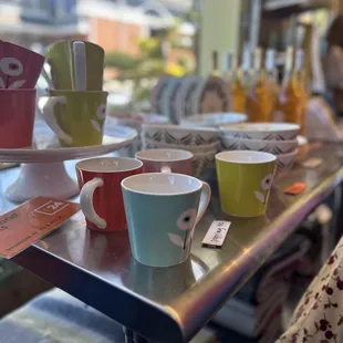 a variety of cups and saucers