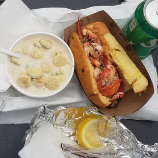 the hot butter lobster roll combo includes a drink and clam chowder.  $35 with tax.