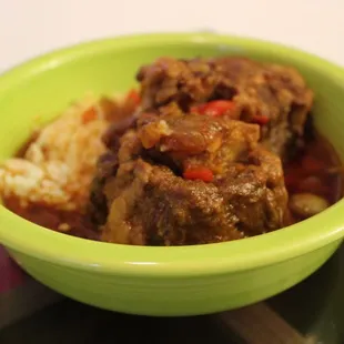 a bowl of stew and rice
