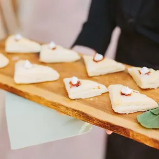 Pissaladiere- Puff pastry wedges with tomato, black olives, caramelized onion, and New Mexican goat cheese.