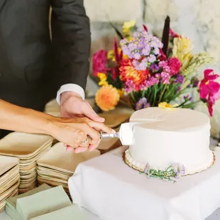 Wedding chocolate cake with buttercream frosting. Note the environment friendly bamboo plates.  (floral arrangements done privately)