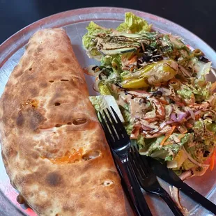 This place never fails me  A calzone with salad