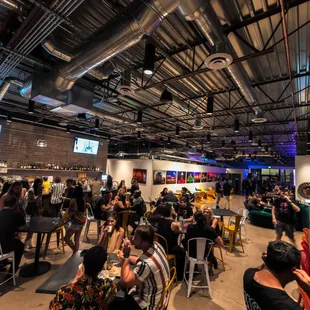 a large group of people sitting at tables