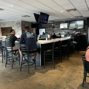 customers sitting at the bar